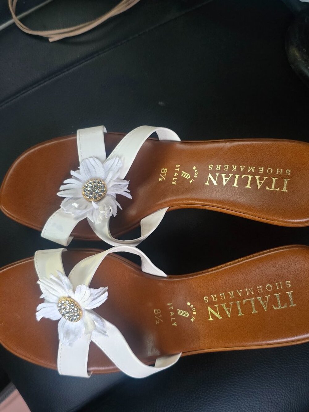 Italian Shoemakers sandals feature white straps adorned with a rhinestone-accent